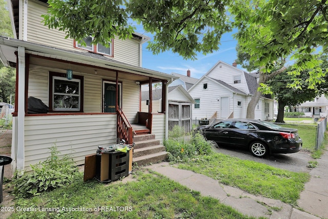 1515 Prospect St, Lansing, MI 48912 - view of front facade with a porch