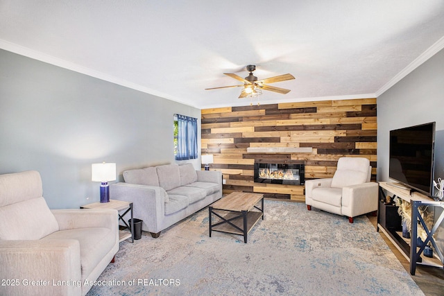 1808 Cadillac Ave, Lansing, MI 48917 - living area with ornamental molding, ceiling fan, wooden walls, and a stone fireplace