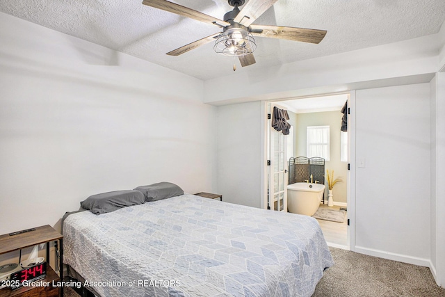 1808 Cadillac Ave, Lansing, MI 48917 - carpeted bedroom featuring baseboards, a textured ceiling, connected bathroom, and a ceiling fan