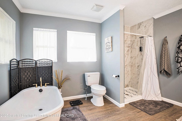1808 Cadillac Ave, Lansing, MI 48917 - full bathroom with toilet, wood finished floors, a freestanding bath, crown molding, and a stall shower