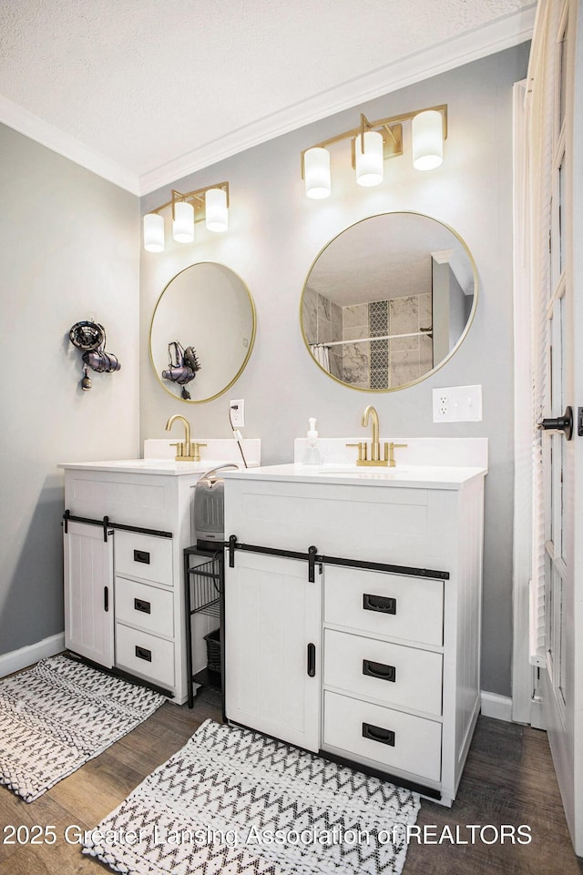 1808 Cadillac Ave, Lansing, MI 48917 - full bath featuring wood finished floors, vanity, crown molding, and baseboards