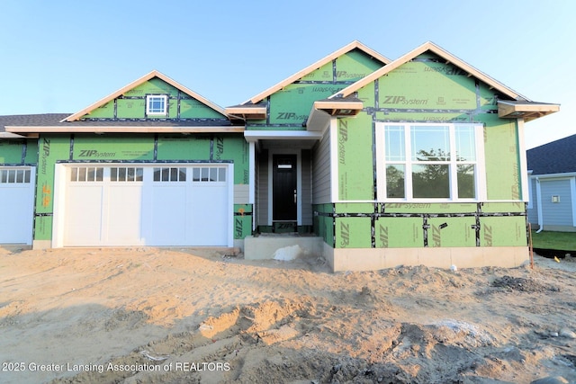 629 Aquila Dr, East Lansing, MI 48823 - property under construction with a garage and driveway