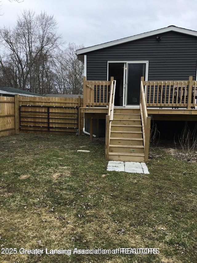 4615 Hughes Rd, Lansing, MI 48910 - rear view of property featuring a deck and stairs