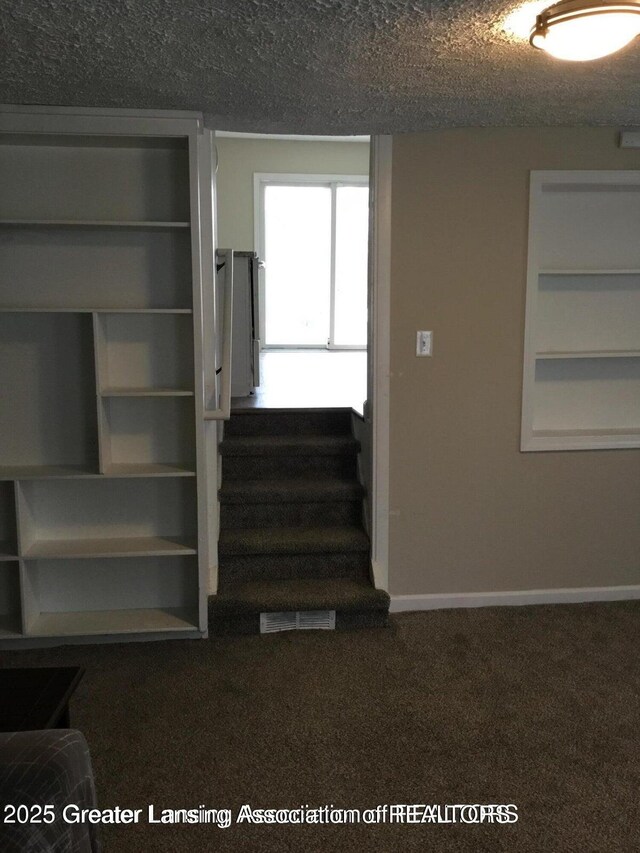 4615 Hughes Rd, Lansing, MI 48910 - staircase featuring carpet and baseboards