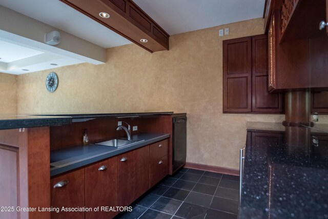 1120 Nautical Dr, Okemos, MI 48864 - kitchen featuring a sink, baseboards, and dark tile patterned floors