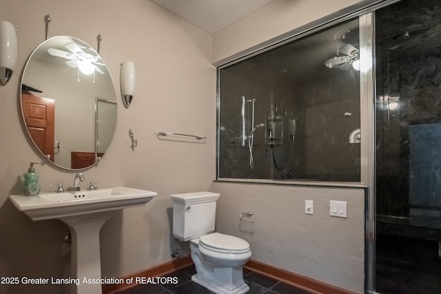 1120 Nautical Dr, Okemos, MI 48864 - full bathroom with tile patterned flooring, toilet, a shower, and baseboards
