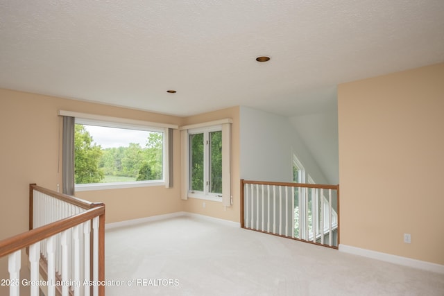 1120 Nautical Dr, Okemos, MI 48864 - carpeted empty room with baseboards and a textured ceiling