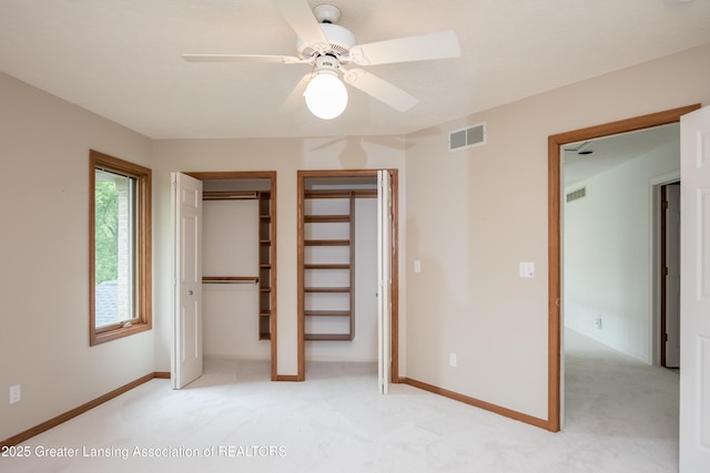 1120 Nautical Dr, Okemos, MI 48864 - unfurnished bedroom featuring light colored carpet, baseboards, and ceiling fan