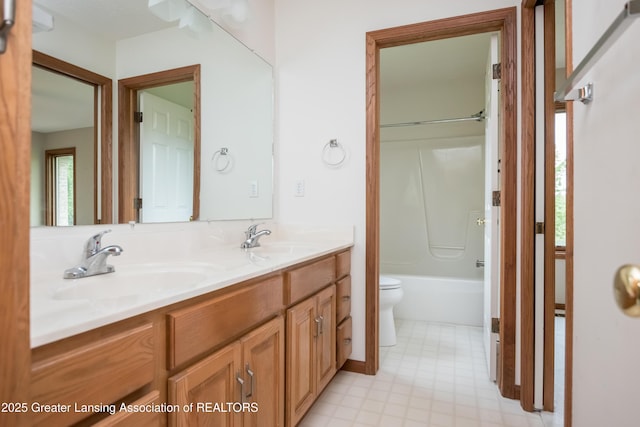 1120 Nautical Dr, Okemos, MI 48864 - bathroom with toilet, double vanity, tile patterned floors, and healthy amount of natural light