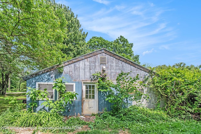 3770 E Frost Rd, Webberville, MI 48892 - back of property with an outbuilding