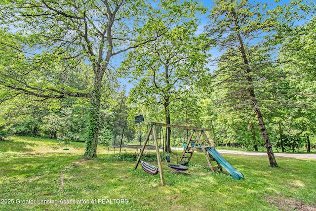3770 E Frost Rd, Webberville, MI 48892 - view of green lawn with a playground