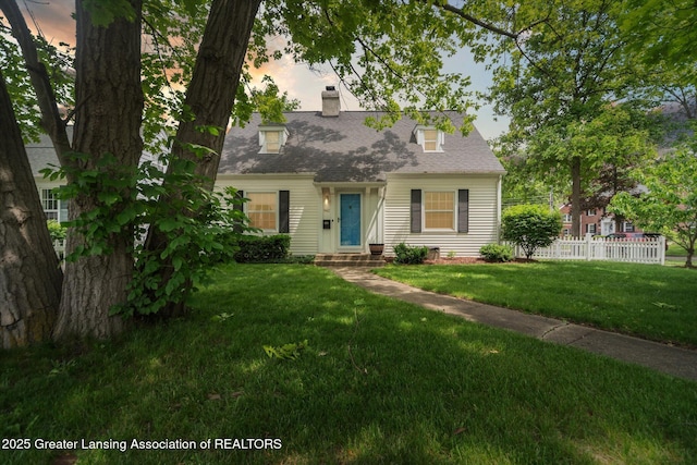 942 W Grand River Ave, East Lansing, MI 48823 - new england style home with a chimney and roof with shingles