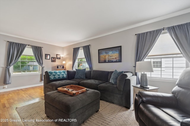 942 W Grand River Ave, East Lansing, MI 48823 - living room featuring ornamental molding and light wood-type flooring