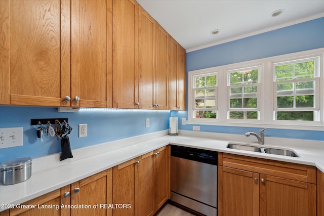 942 W Grand River Ave, East Lansing, MI 48823 - kitchen featuring stainless steel dishwasher, healthy amount of natural light, light countertops, brown cabinets, and ornamental molding