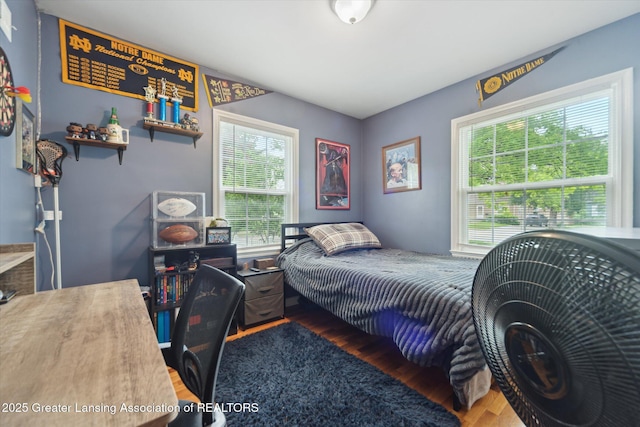 942 W Grand River Ave, East Lansing, MI 48823 - bedroom featuring wood finished floors