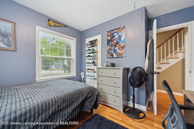 942 W Grand River Ave, East Lansing, MI 48823 - bedroom with wood finished floors and baseboards