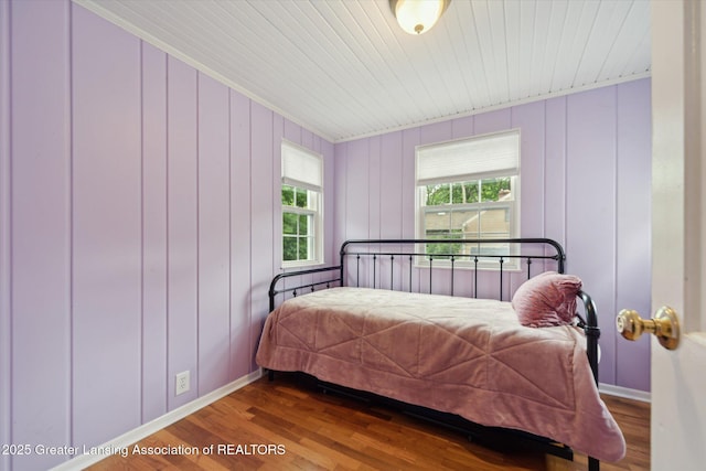 942 W Grand River Ave, East Lansing, MI 48823 - bedroom featuring wood finished floors and crown molding