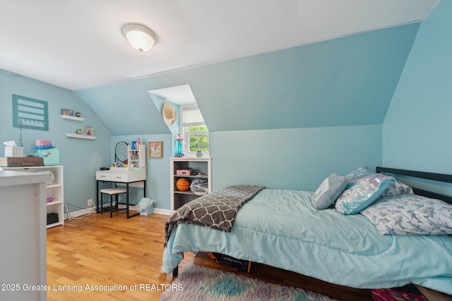 942 W Grand River Ave, East Lansing, MI 48823 - bedroom with wood finished floors and vaulted ceiling