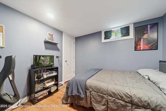 942 W Grand River Ave, East Lansing, MI 48823 - bedroom featuring wood finished floors