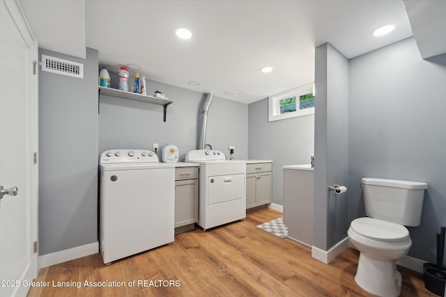 942 W Grand River Ave, East Lansing, MI 48823 - washroom with separate washer and dryer, light wood-type flooring, and recessed lighting