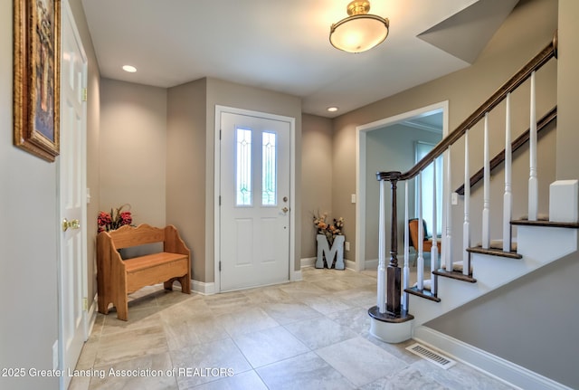 6108 Skyline Dr, East Lansing, MI 48823 - foyer with recessed lighting, stairway, and baseboards