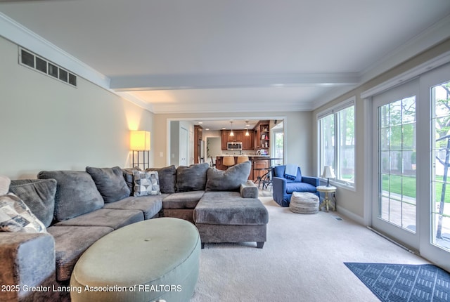 6108 Skyline Dr, East Lansing, MI 48823 - living area featuring light colored carpet, crown molding, and beam ceiling
