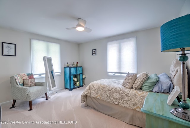 6108 Skyline Dr, East Lansing, MI 48823 - carpeted bedroom with multiple windows, a ceiling fan, and baseboards