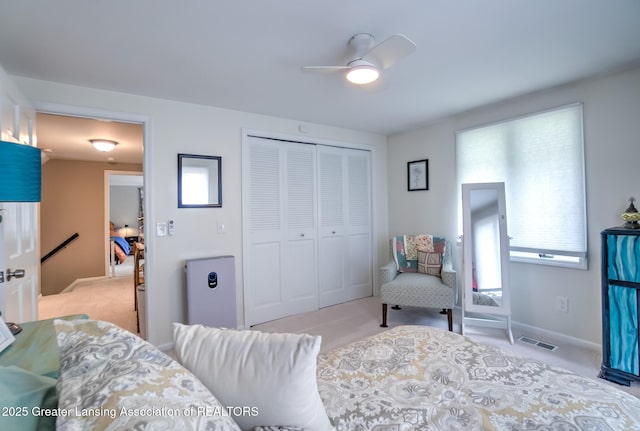 6108 Skyline Dr, East Lansing, MI 48823 - bedroom featuring carpet floors, a closet, baseboards, and ceiling fan