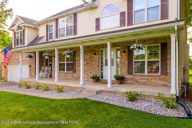 5871 Green Rd, Haslett, MI 48840 - view of front of house featuring a porch and a front yard