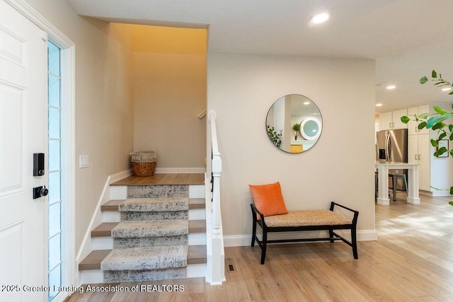5871 Green Rd, Haslett, MI 48840 - staircase with wood finished floors and recessed lighting