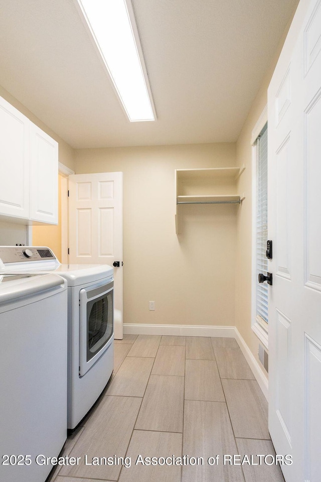 5871 Green Rd, Haslett, MI 48840 - washroom featuring cabinet space and separate washer and dryer
