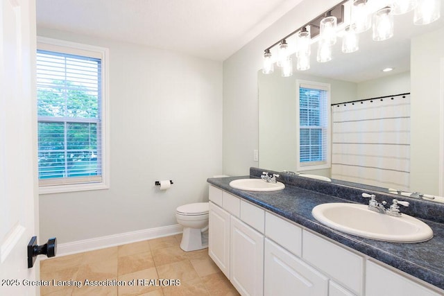 5871 Green Rd, Haslett, MI 48840 - bathroom featuring double vanity, tile patterned flooring, and curtained shower