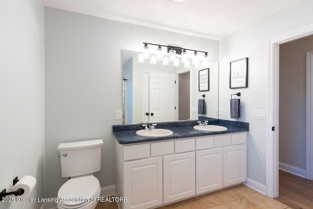 5871 Green Rd, Haslett, MI 48840 - full bathroom with double vanity and toilet
