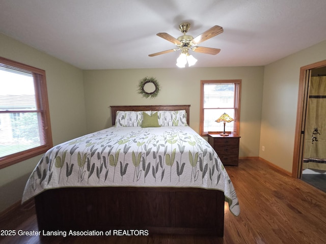 2380 S Waverly Rd, Eaton Rapids, MI 48827 - bedroom with wood finished floors, baseboards, and ceiling fan