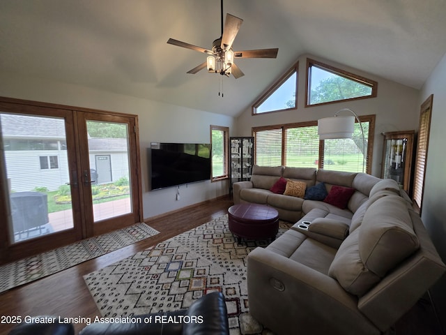 2380 S Waverly Rd, Eaton Rapids, MI 48827 - living room with wood finished floors, french doors, ceiling fan, and high vaulted ceiling