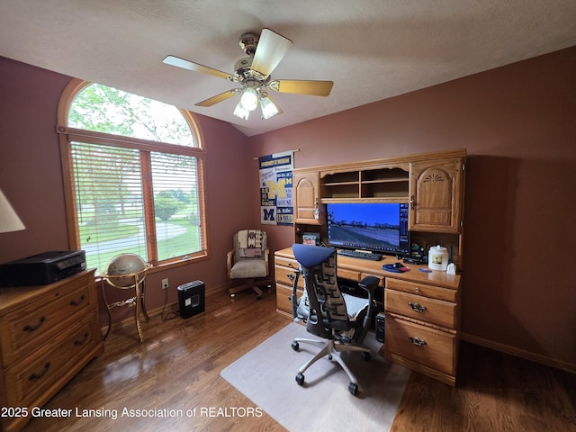 2380 S Waverly Rd, Eaton Rapids, MI 48827 - office featuring dark wood finished floors, baseboards, ceiling fan, and vaulted ceiling