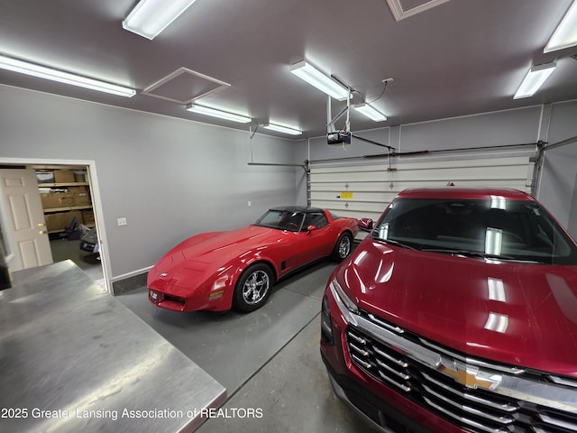 2380 S Waverly Rd, Eaton Rapids, MI 48827 - garage featuring a garage door opener