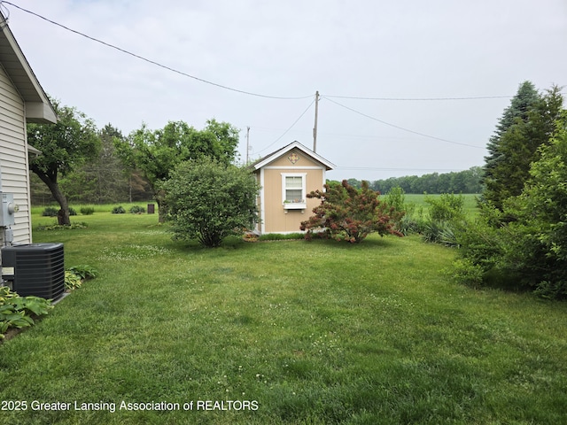 2380 S Waverly Rd, Eaton Rapids, MI 48827 - view of grassy yard featuring central air condition unit
