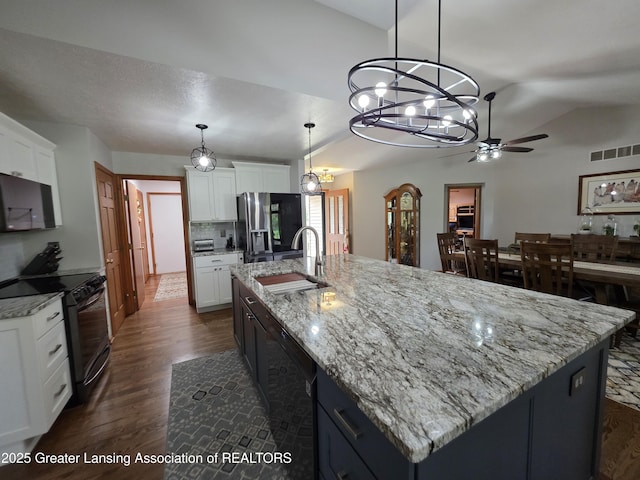 2380 S Waverly Rd, Eaton Rapids, MI 48827 - kitchen featuring black appliances, a sink, a chandelier, ceiling fan, and white cabinetry