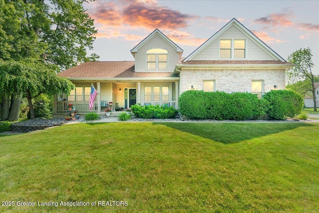 2134 Cedar Bend Dr, Holt, MI 48842 - traditional home featuring covered porch and a lawn