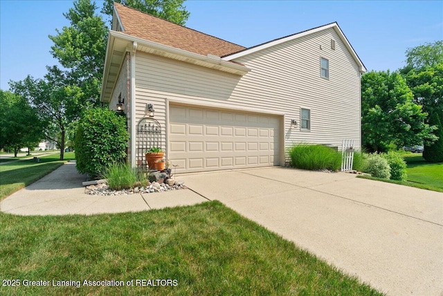 2134 Cedar Bend Dr, Holt, MI 48842 - view of home's exterior with concrete driveway, an attached garage, a yard, and roof with shingles