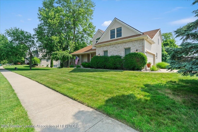2134 Cedar Bend Dr, Holt, MI 48842 - view of front facade featuring brick siding, a front lawn, and a garage