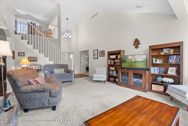 2134 Cedar Bend Dr, Holt, MI 48842 - carpeted living room with stairway, high vaulted ceiling, and a chandelier