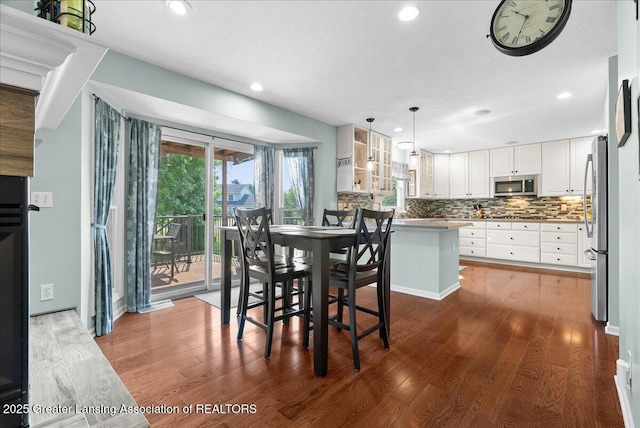 2134 Cedar Bend Dr, Holt, MI 48842 - dining space featuring recessed lighting and wood finished floors
