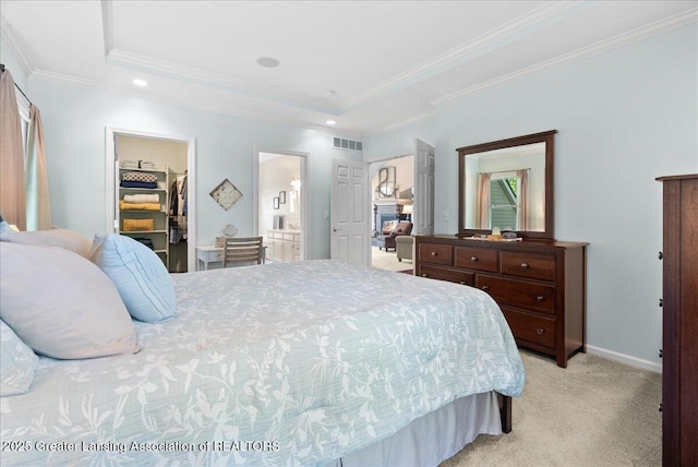 2134 Cedar Bend Dr, Holt, MI 48842 - bedroom featuring a raised ceiling, light carpet, a walk in closet, ornamental molding, and a closet