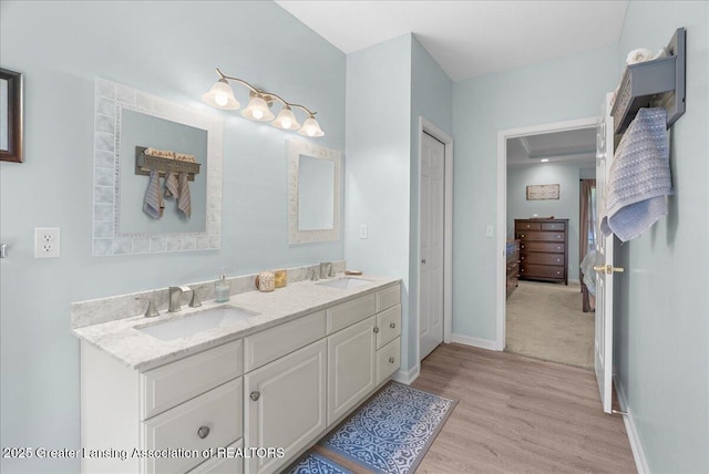 2134 Cedar Bend Dr, Holt, MI 48842 - full bath featuring double vanity, wood finished floors, and ensuite bath