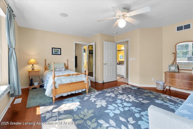 2134 Cedar Bend Dr, Holt, MI 48842 - bedroom with wood finished floors, a spacious closet, and a ceiling fan