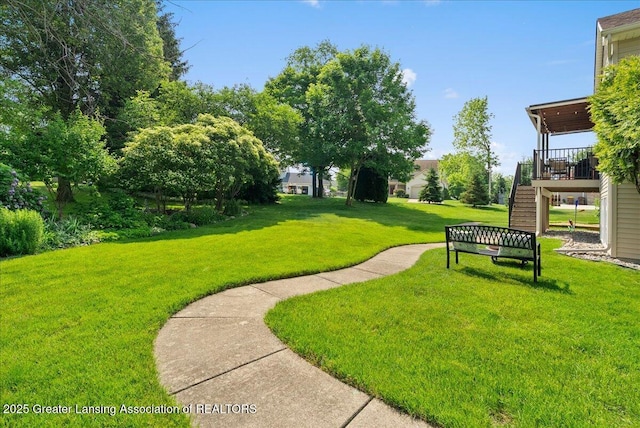 2134 Cedar Bend Dr, Holt, MI 48842 - view of community featuring stairs, a lawn, and a deck