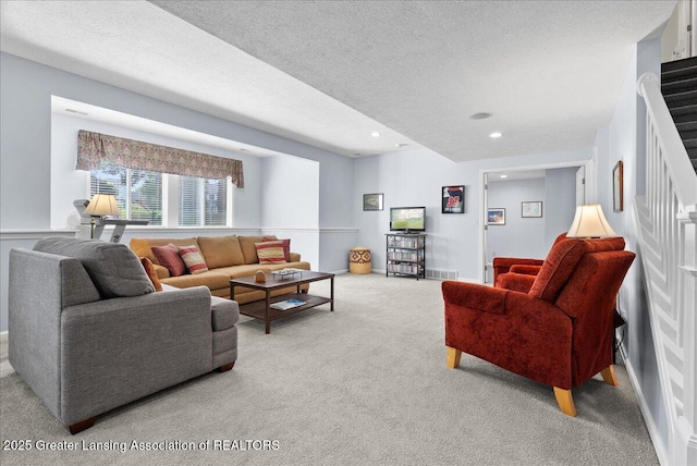 2134 Cedar Bend Dr, Holt, MI 48842 - carpeted living room with recessed lighting, a textured ceiling, and stairway