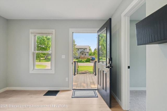 2506 W Kalamazoo St, Lansing, MI 48917 - doorway featuring wood finished floors and baseboards